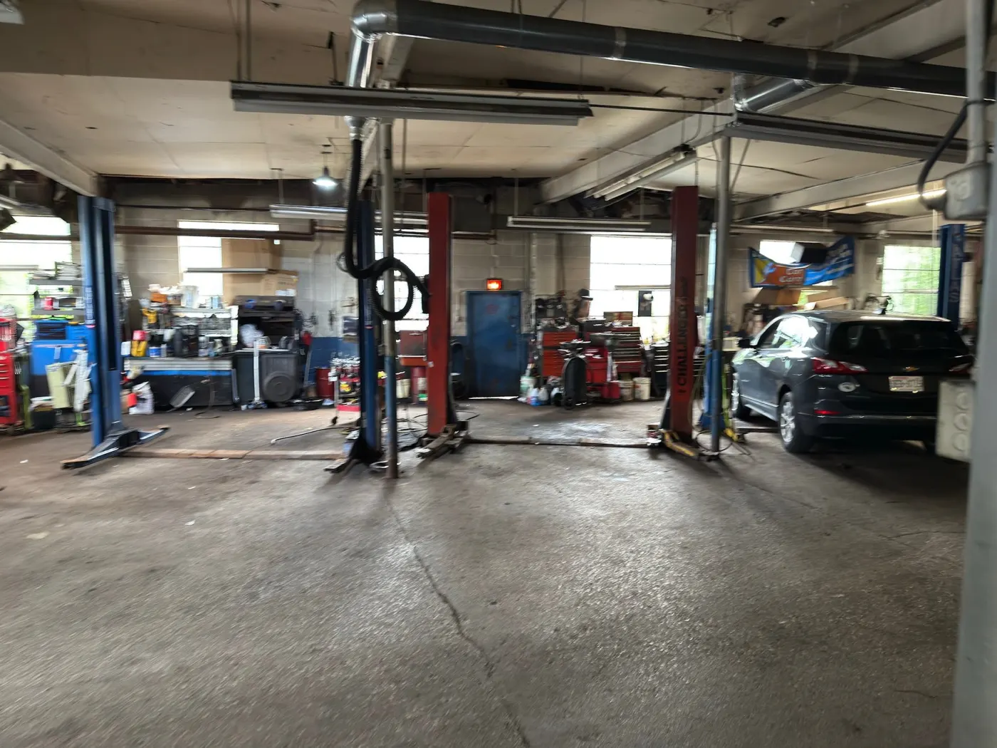 Service bay with lifts and tool chests